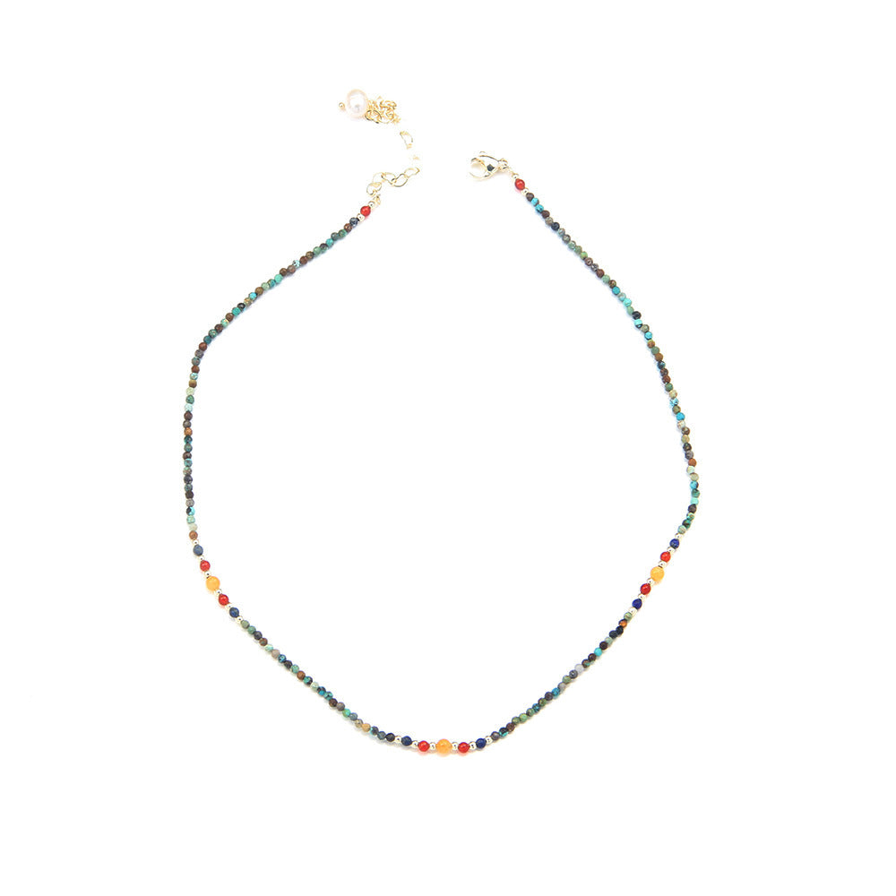 Multicolored beaded necklace on a white background