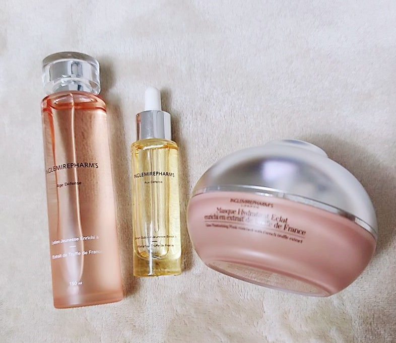Three skincare products from Clinique on a beige background