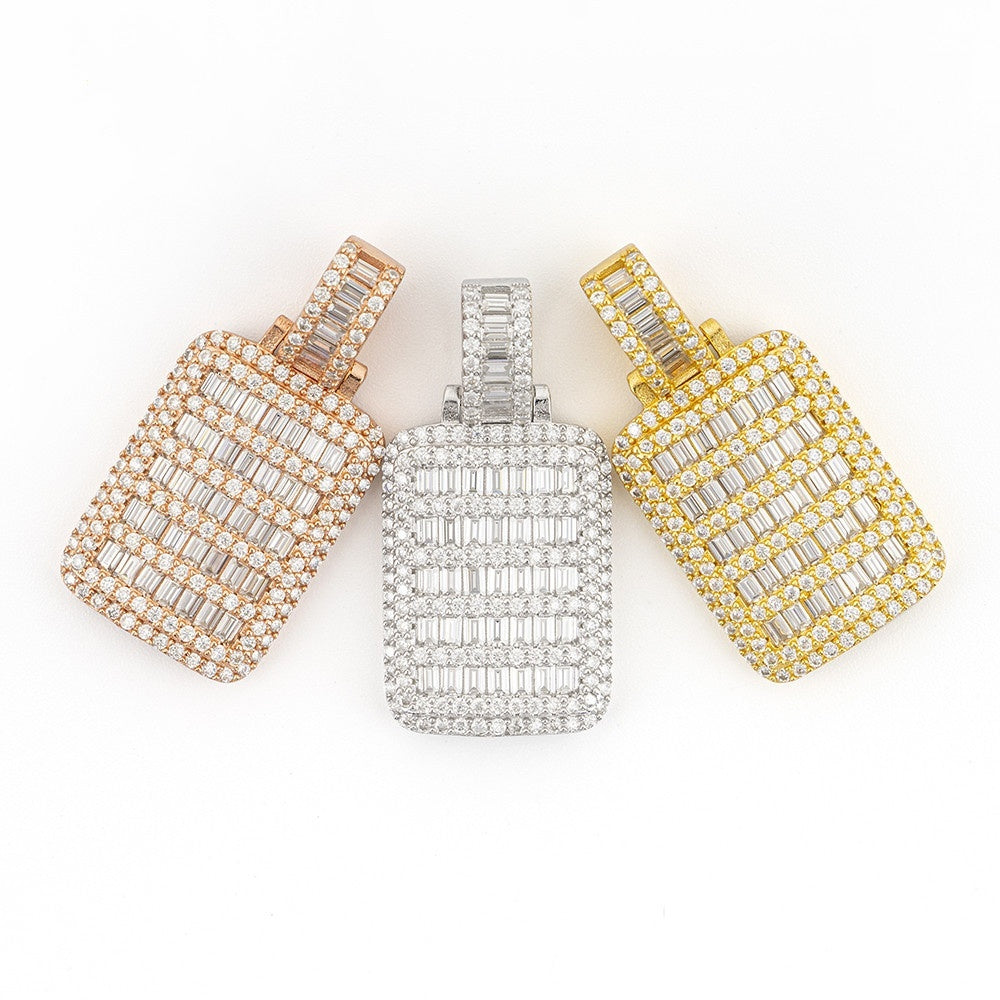 Three diamond-encrusted pendants in gold, silver, and yellow gold on a white background