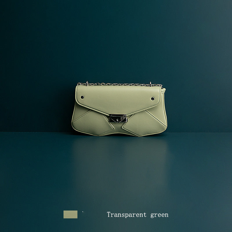 Green handbag on a dark green background
