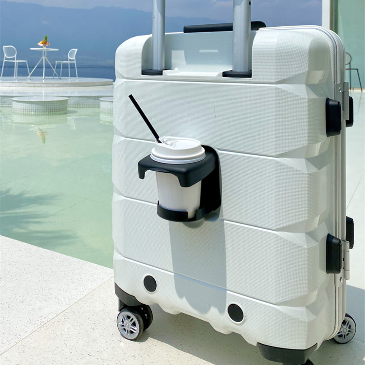 White suitcase with a coffee cup holder attached, by a poolside.