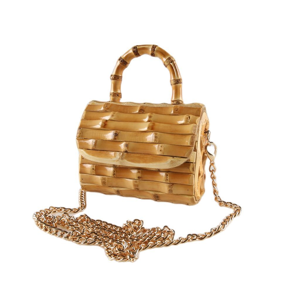 Gold bamboo-style handbag with chain strap on a white background