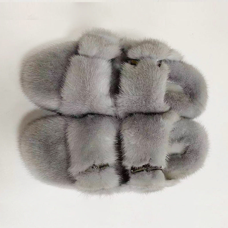 Gray fur slippers on a white background