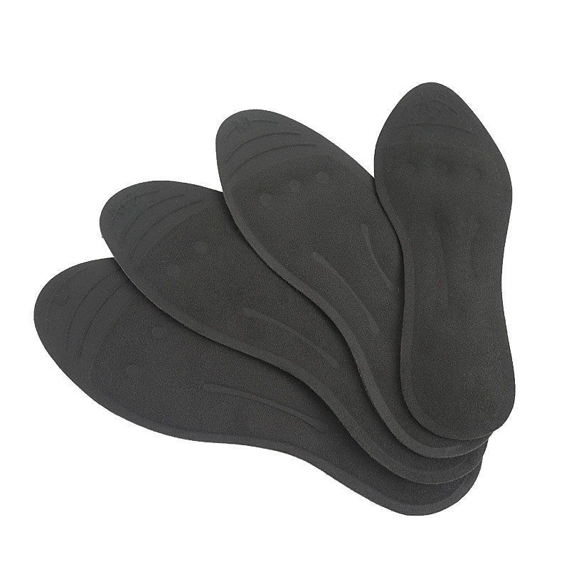 Four pairs of black shoe inserts on a white background