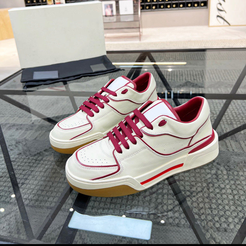 White sneakers with red accents on a glass table