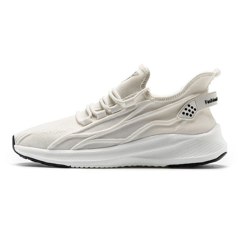 White sneaker with black sole on a white background