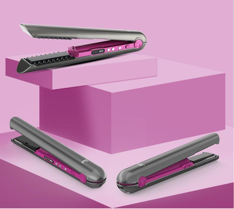Hair straightener on a pink geometric background