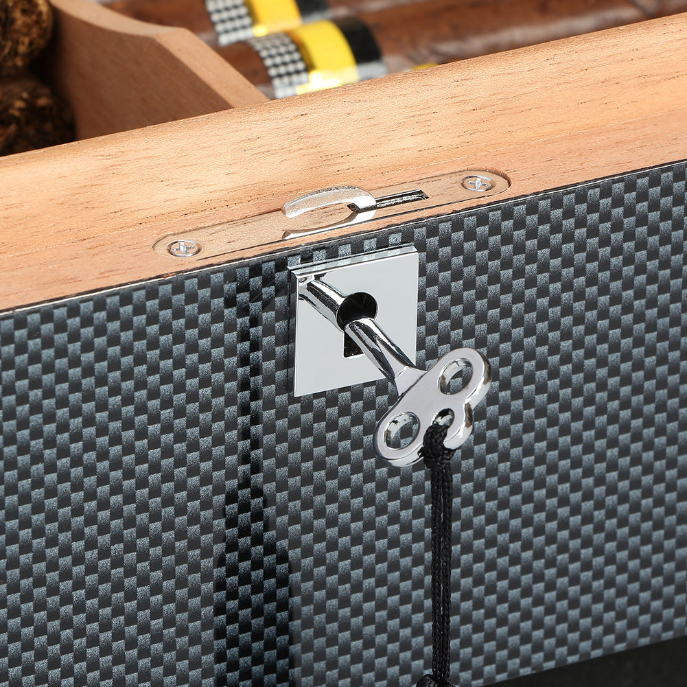 Close-up of a wooden and carbon fiber textured box with a metallic lock.