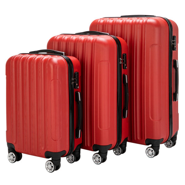Three red suitcases of different sizes on a white background