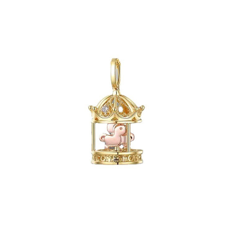 Gold pendant with a pink heart inside a decorative cage on a white background