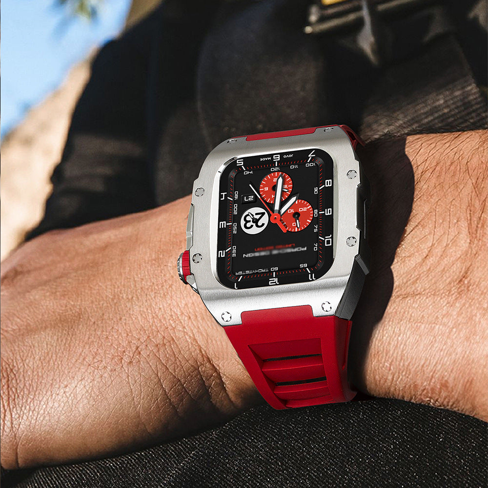 Watch with a red strap and black face on a wrist, blurred background