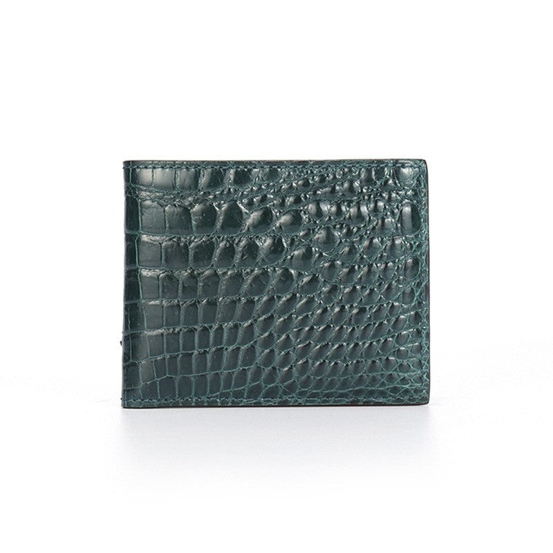Green crocodile-patterned wallet on a white background