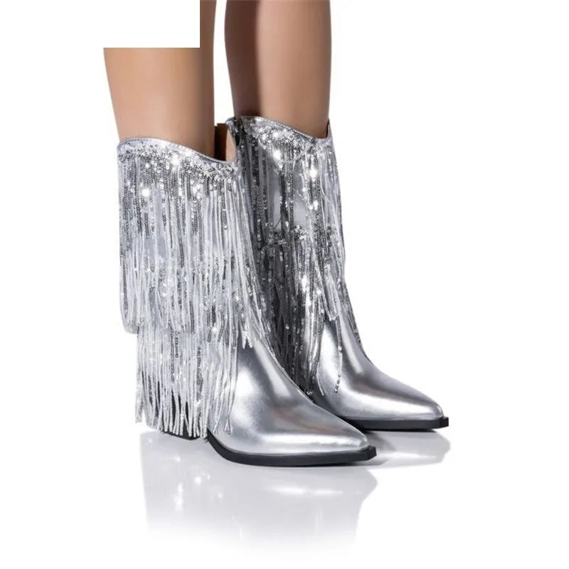 Silver fringe boots on a white background