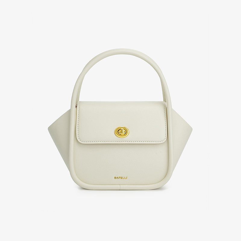 White handbag with a gold clasp on a light gray background