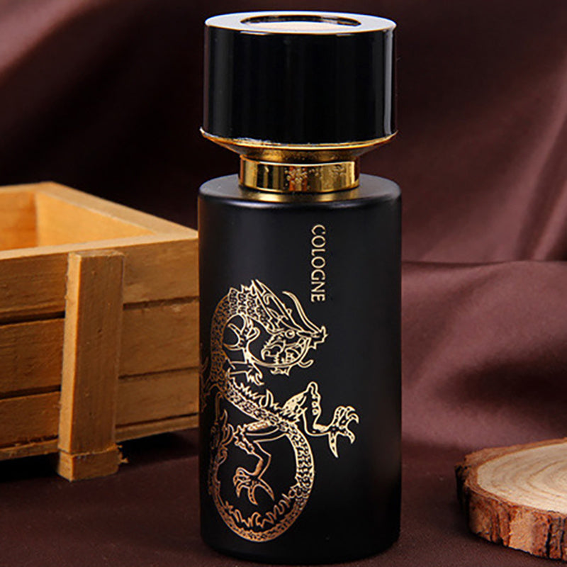 Black cologne bottle with gold lizard design on a dark background