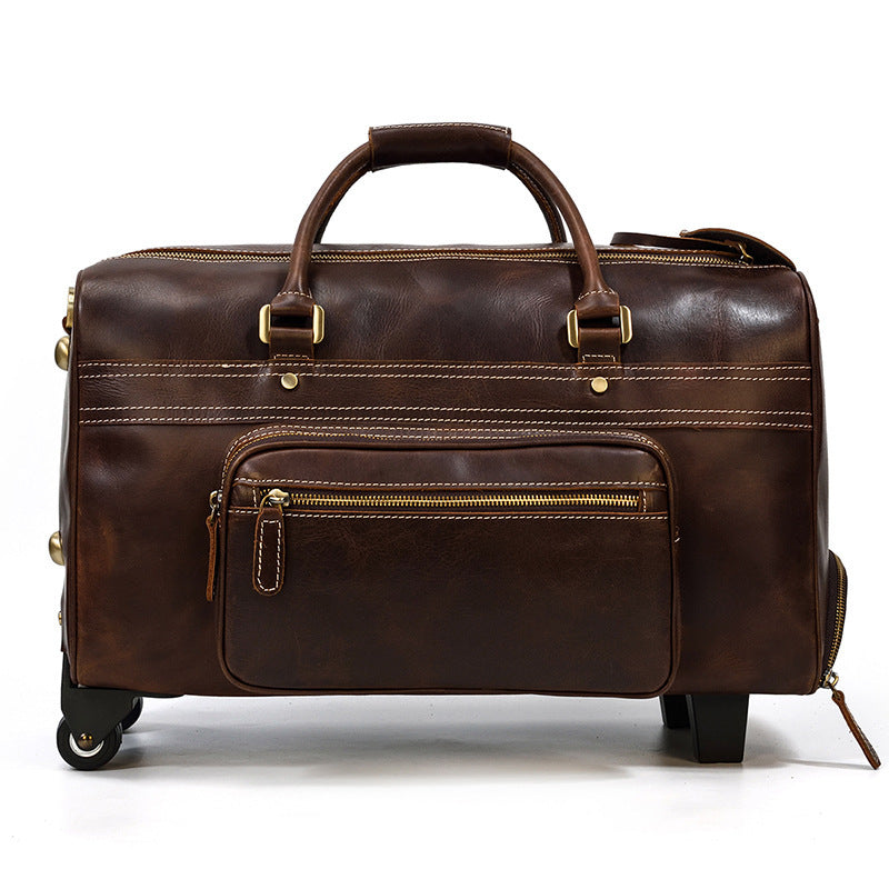 Brown leather suitcase with gold zippers on a white background