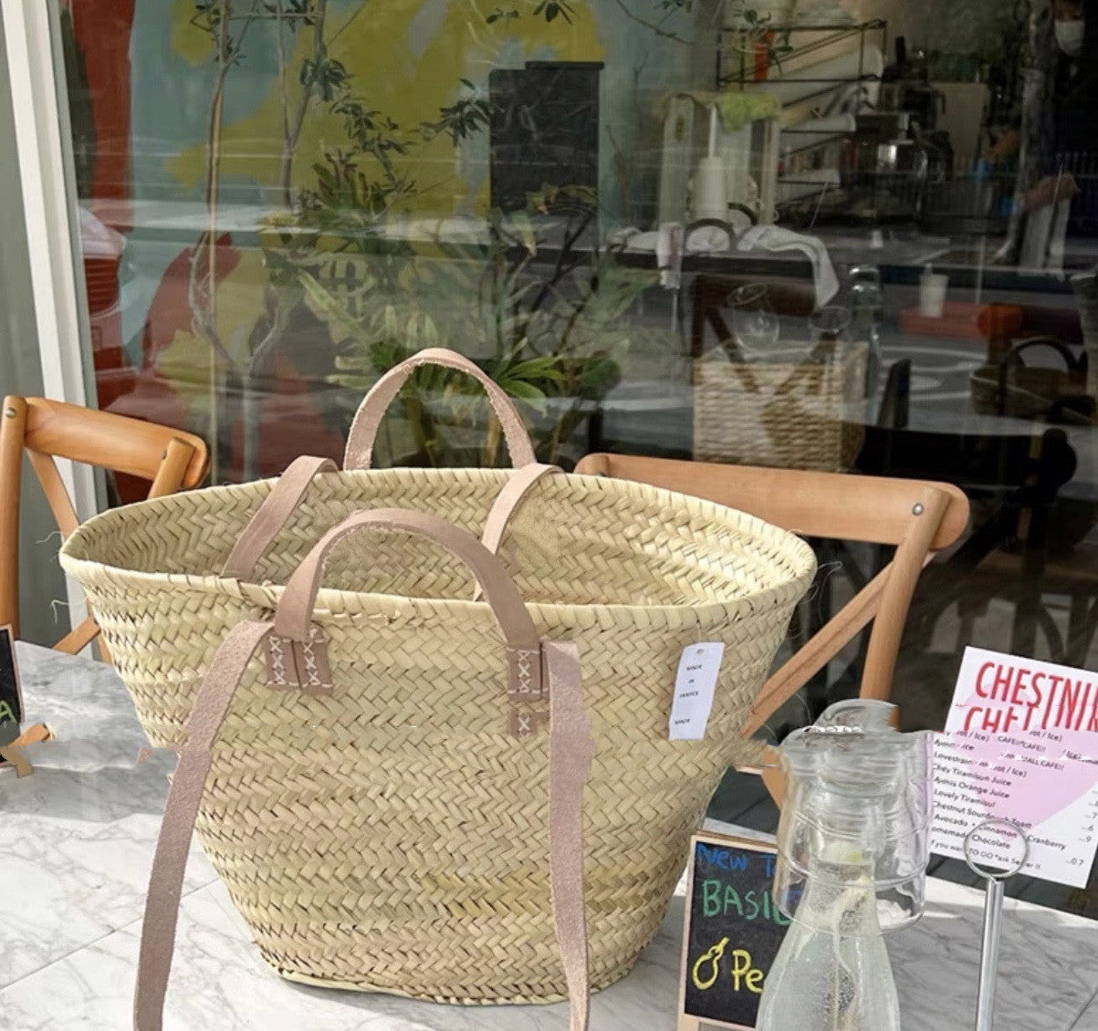 Woven basket with handles on a table in a casual setting