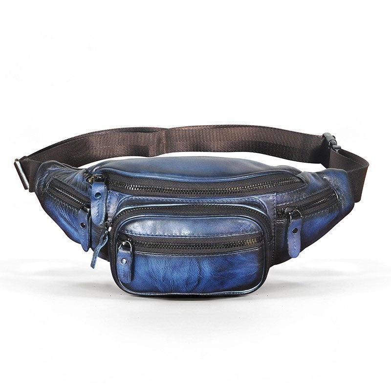 Blue fanny pack with multiple zippers on a white background