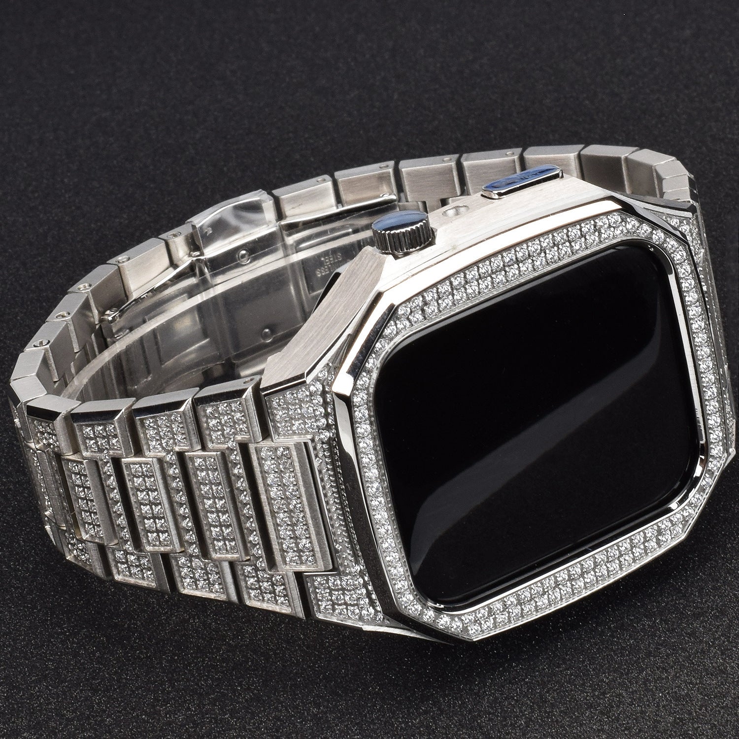 Luxury silver watch with diamond-studded band on a dark background