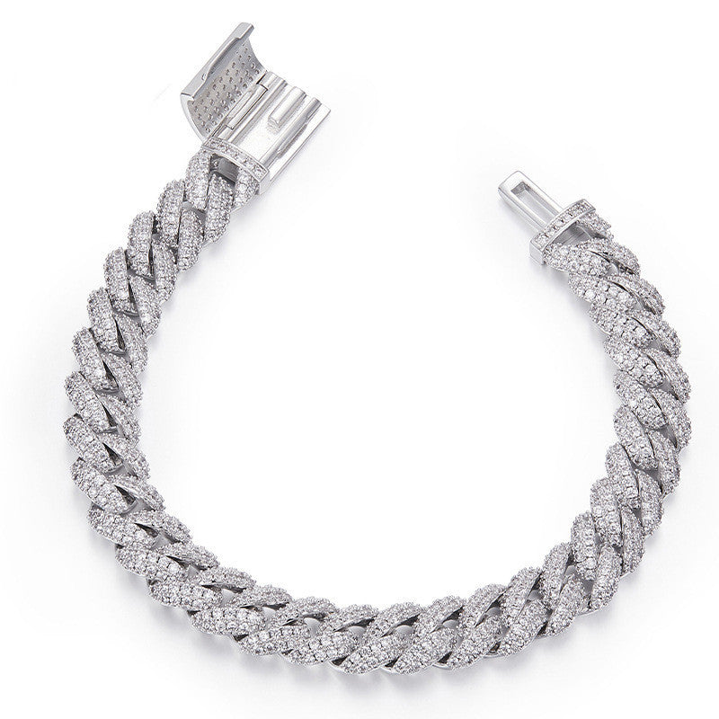 Silver braided bracelet with clear stones on a white background
