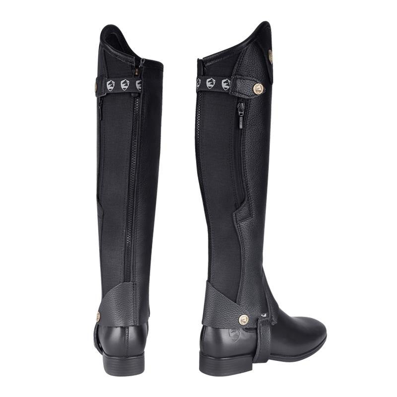 Pair of black riding boots with zippers on a white background