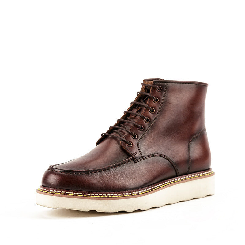 Brown leather boot with white sole on a white background