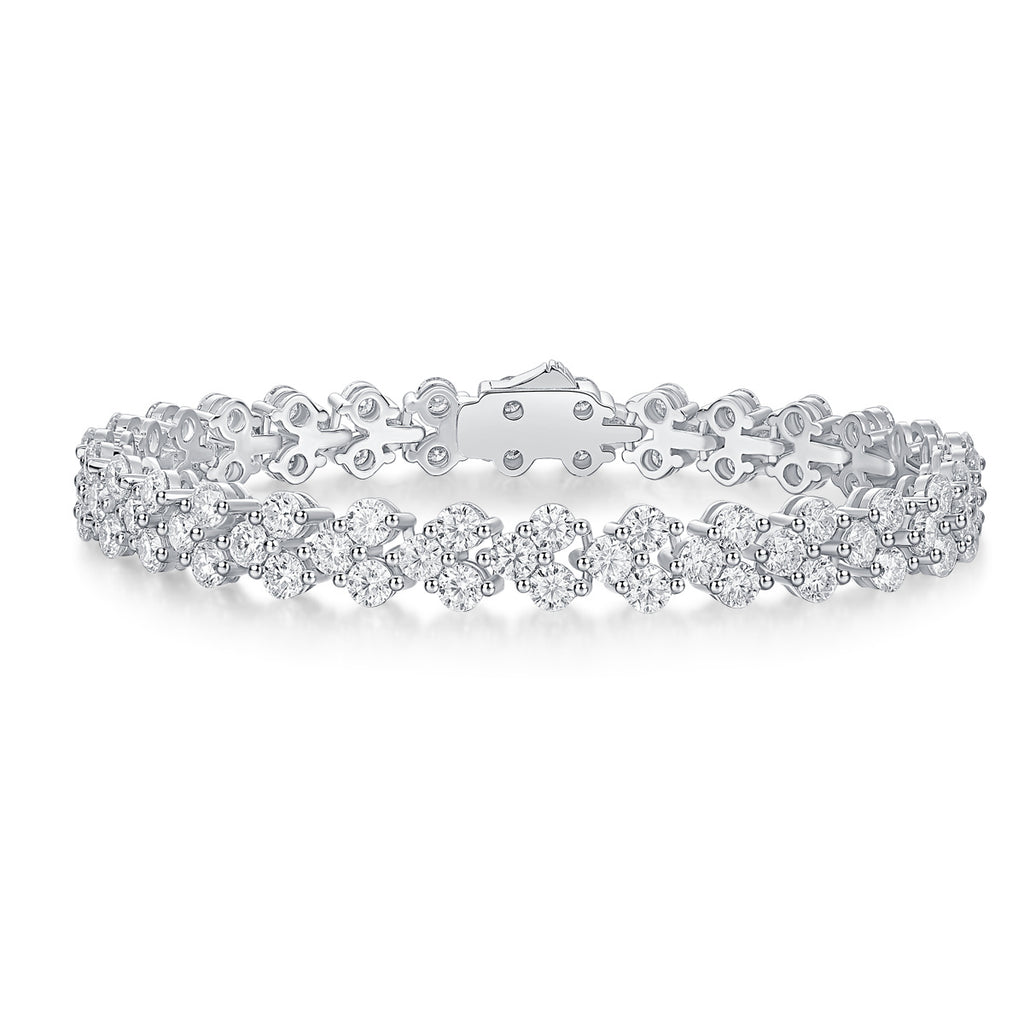 Silver bracelet with clear stones on a white background