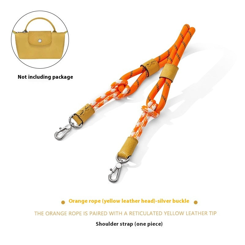 Orange rope shoulder strap with yellow leather head and silver buckle on a white background