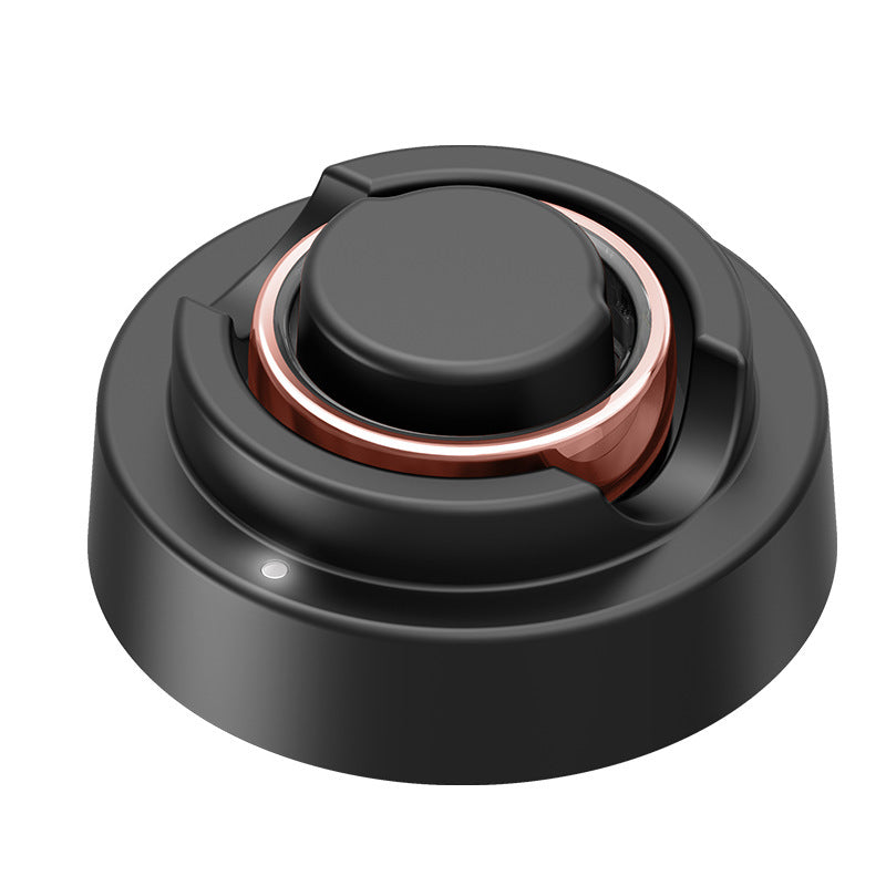 Black and copper mechanical component on a white background
