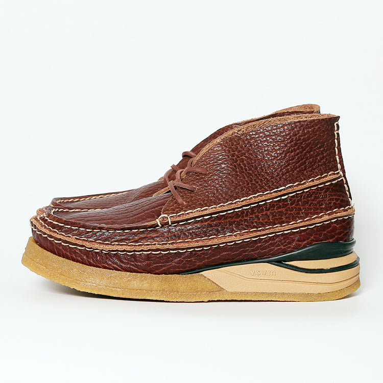 Brown leather shoe with a white background