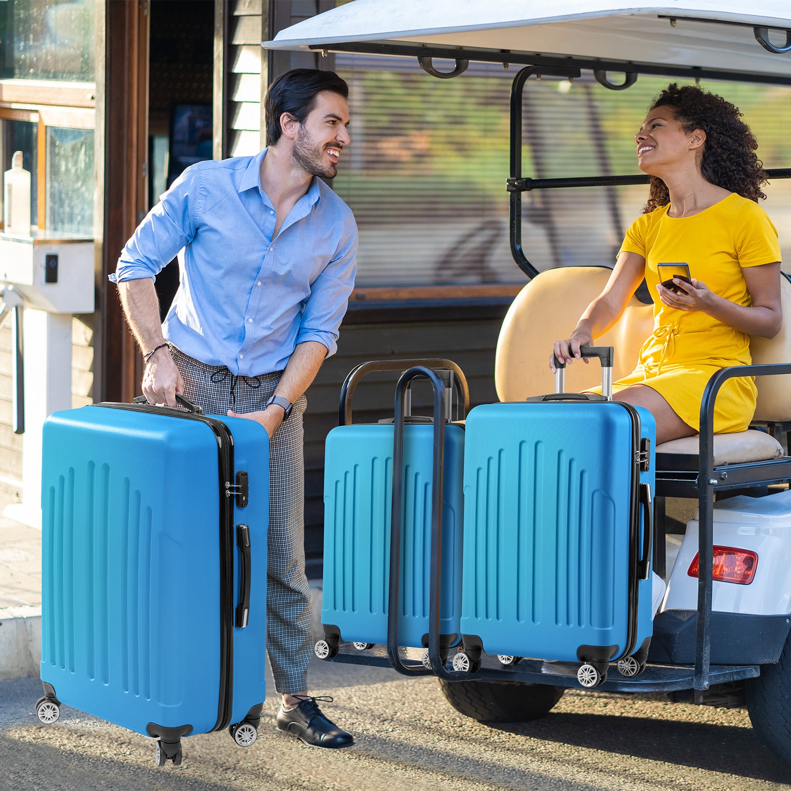 Man and woman with blue suitcases near a vehicle