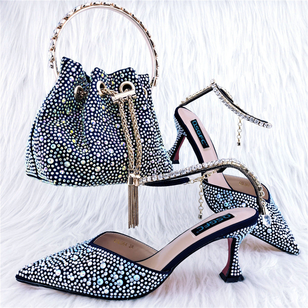 Pair of embellished high-heeled shoes and matching handbag on a white background