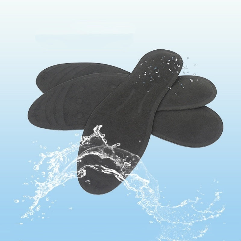 Black shoe inserts with water splash on a light blue background