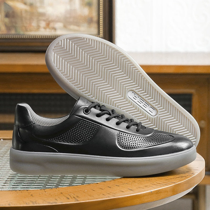 Black sneaker with white sole on a wooden surface