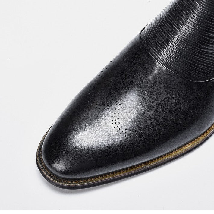 Close-up of a black leather shoe on a light gray background