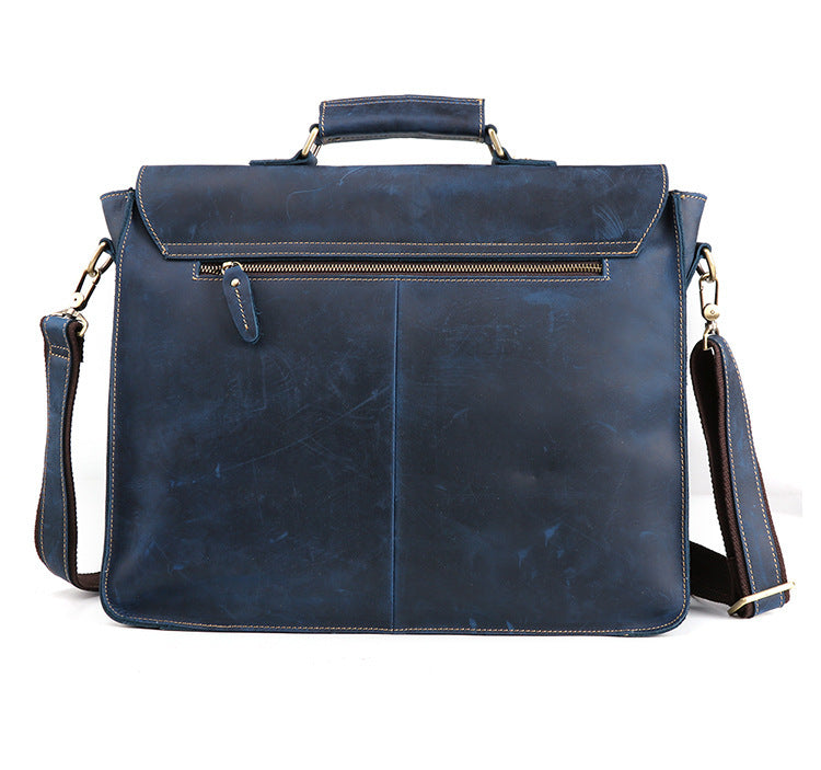 Blue leather briefcase with shoulder strap on a white background