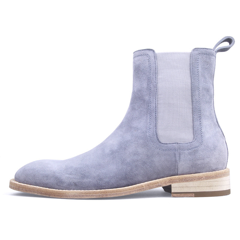 Light blue suede Chelsea boot on a white background
