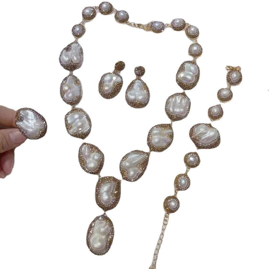 Pearl necklace with matching earrings on a white background